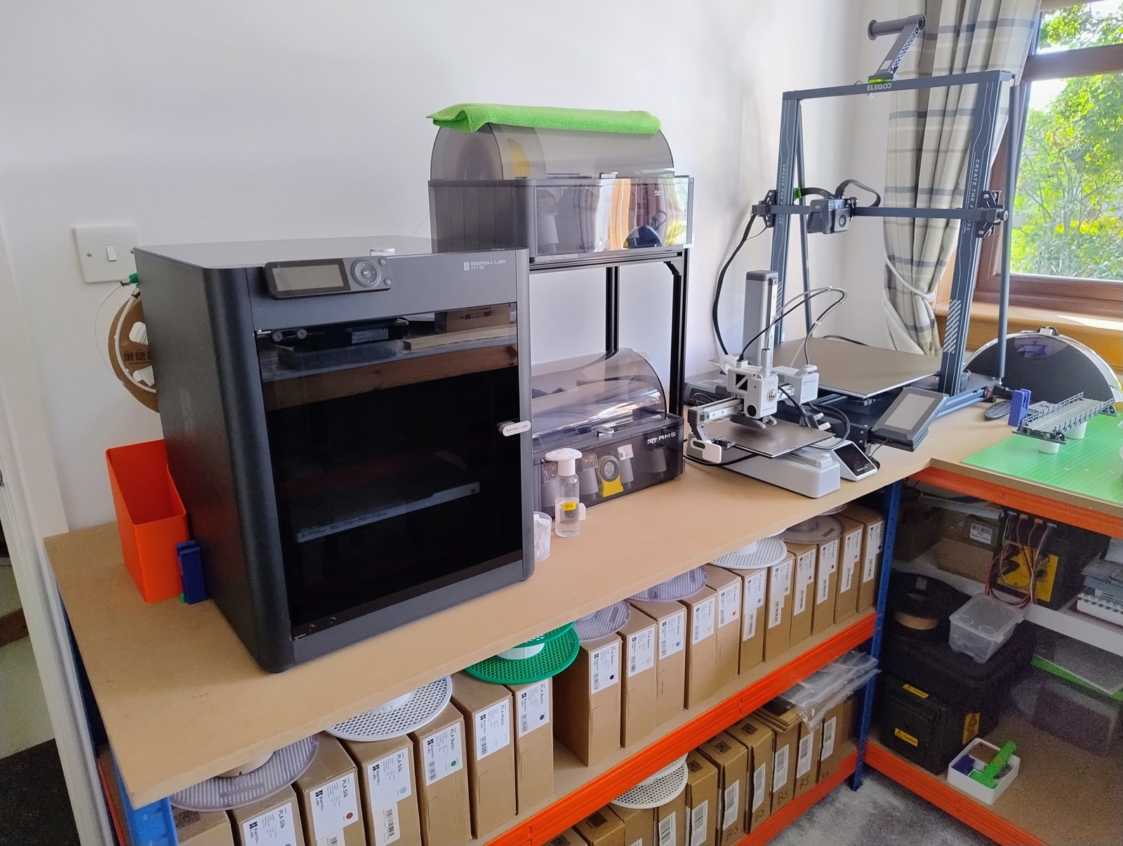 3D printing station with Bambu Lab printer and filament storage