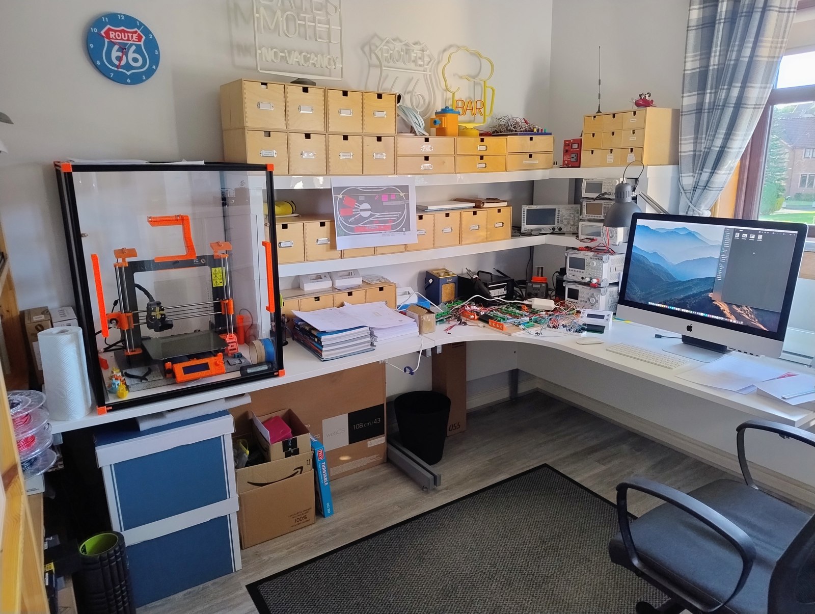 Full corner workshop setup with desk, shelving, and computer