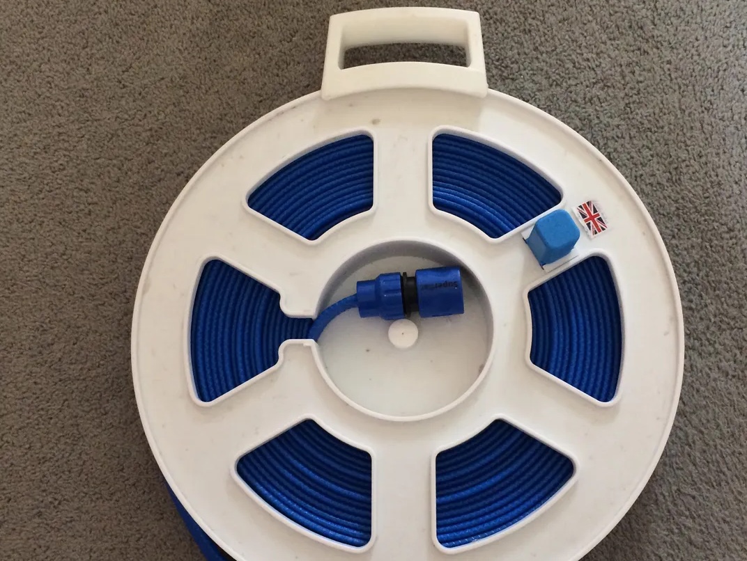 Finished replacement handle mounted to a water hose reel